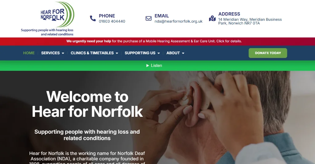 Screenshot of the Hear for Norfolk website homepage, displaying contact information, navigation menu, tagline, and a donation request banner at the top.